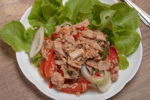 Spicy Tuna Salad in white plate photo