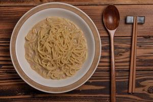 Udon noodles in a bowl of Japanese food photo