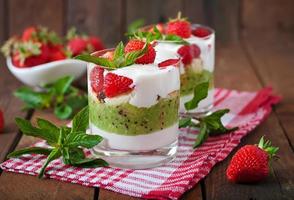 Creamy dessert with strawberries and kiwi photo