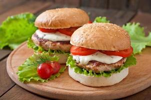 Appetizing hamburger with chicken burger and sauce Tartar photo