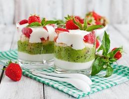 Creamy dessert with strawberries and kiwi photo