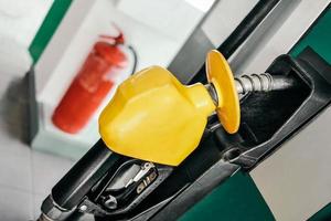 Close-up fuel nozzles at gas station photo