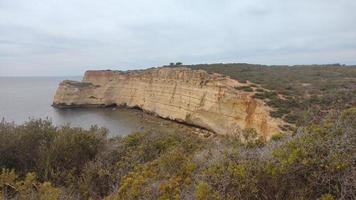 Portugal algarve landskape blue ocean and yellow canyon photo