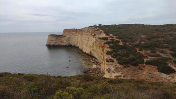 Portugal algarve landskape blue ocean and yellow canyon photo