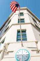 Tacoma, Washington, USA. March 2022. The American national flag and the clock on the building in downtown photo