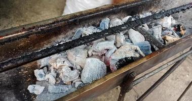 White charcoal details for searing food on a grill photographed from the side photo