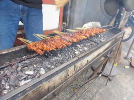 satay. is a typical indonesian food that is cooked by grilling. isolated when the combustion process takes place photo