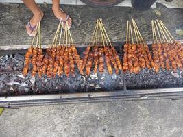 satay. is a typical indonesian food that is cooked by grilling. isolated when the combustion process takes place photo