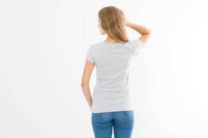 Woman in template blank t shirt isolated on white background. Back view. Mock up. Copy space. photo