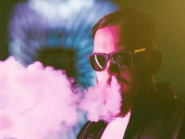 bearded man vaping. photo