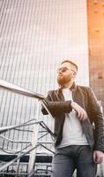 Beautiful brutal man in leather jacket photo