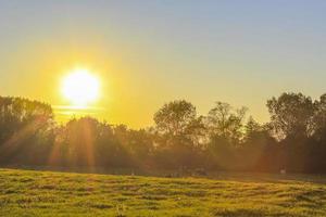 North Germany agricultural nature landscape with sunset. photo