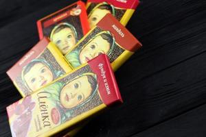 KHARKIV, UKRAINE - JANUARY 27, 2021 Alyonka chocolate square bars - product from Red October chocolate factory. Old russian traditional chocolate photo