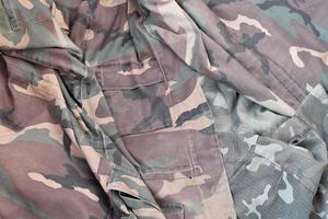 Camouflage background texture as backdrop for hunting or fishing design projects photo
