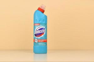 KHARKOV, UKRAINE - JULY 2, 2021 Domestos Blue bottle. Domestos is a household cleaning range which contains bleach manufactured by Unilever photo