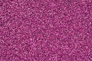 Pink decorative sequins. Background image with shiny bokeh lights from small elements photo