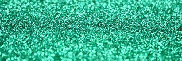 A huge amount of decorative sequins. Background image with shiny bokeh lights from small elements photo