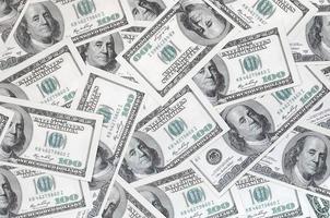 A pattern of many dollar bills. Background image photo