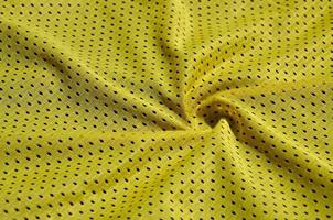 Texture of sportswear made of polyester fiber. Outerwear for sports training has a mesh texture of stretchable nylon fabric photo