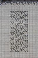 A pattern made of white bricks in the form of diamond shapes. Decoration of the walls during the Soviet Union photo