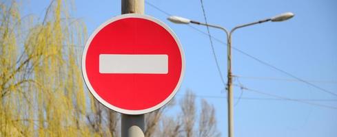 Road sign in the form of a white rectangle in a red circle. No entry photo