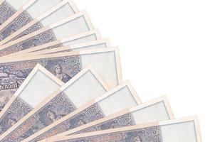 100 Reich marks bills lies isolated on white background with copy space stacked in fan close up photo