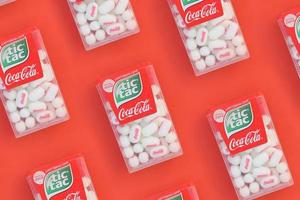 KHARKOV, UKRAINE - JULY 2, 2021 Many Tic Tac Candy packages with Coca-Cola taste. Tic tac is popular due its minty fresh taste and easy to carry. Hard mints produced by Ferrero since 1968 photo