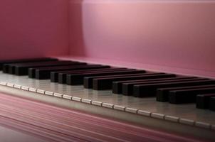 Close-up of the keyboard of a pink piano. Set of white and black buttons photo