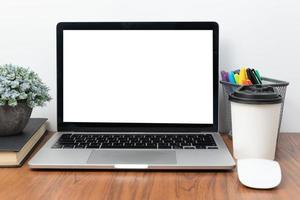 Computer laptop and coffee cup mouse on desk.Flat lay with blank copy space. photo