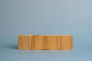 Four blank wooden block cubes on background for your text. Business concept template and banner. photo