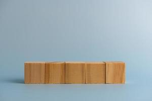 Five blank wooden block cubes on background for your text. Business concept template and banner. photo