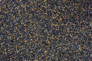 Background from small stone chips of black and orange colors photo