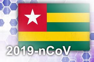 Togo flag and futuristic digital abstract composition with 2019-nCoV inscription. Covid-19 outbreak concept photo