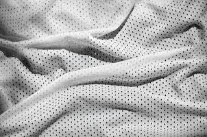 Close up of white polyester nylon sportswear shorts to created a textured background photo