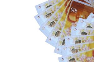 100 Israeli new shekels bills lies isolated on white background with copy space. Rich life conceptual background photo