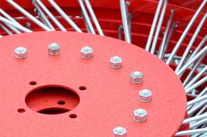 New red tedder for trailer in agricultural machinery for gathering hay. Close up photo
