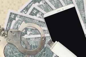 2 US dollars bills and smartphone with police handcuffs. Concept of hackers phishing attacks, illegal scam or malware soft distribution photo