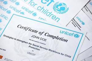 TERNOPIL, UKRAINE - MAY 2, 2022 Volunteer certificate of completion from UNICEF - United Nations programm that provides humanitarian and developmental assistance to children photo