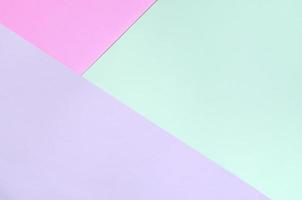 fondo de textura de colores pastel de moda. papeles con motivos geométricos rosas, violetas y azules. foto