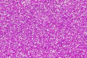 Pink decorative sequins. Background image with shiny bokeh lights from small elements photo