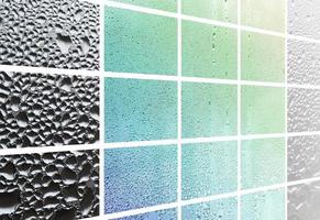 A collage of many different fragments of glass, decorated with rain drops from the condensate. Spring tones with green and blue colors photo
