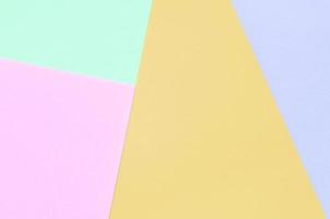 Texture background of fashion pastel colors. Pink, violet, orange and blue geometric pattern papers. photo