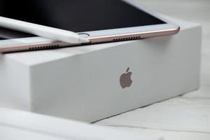 KHARKIV, UKRAINE - JANUARY 27, 2021 Brand new Apple iPad and Apple Pencil on white background. Apple Inc. is an American technology company photo