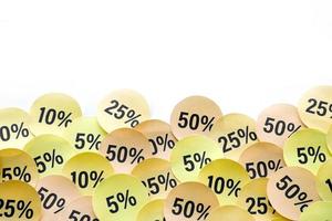 Large amount of stickers with yellow percentage values for black friday or cyber monday sale. Abstract image of discount prices photo