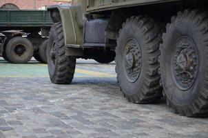 Close up of green military truck. Modern military transportation vehicle technologies photo