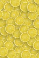 Pattern of yellow lemon citrus slices. Citrus flat lay photo