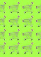 Shopping addiction, shopping lover or shopaholic concept. Many small empty shopping carts perform a pattern on a pastel colored paper background. Flat lay composition, top view photo