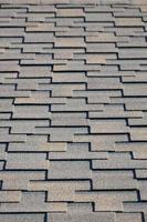 Modern roofing and decoration of chimneys. Flexible bitumen or slate shingles photo