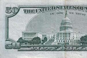 US Capitol on 50 dollars banknote back side closeup macro fragment. United states fifty dollars money bill photo