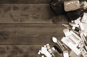 A lot of narcotic substances and devices for the preparation of drugs lie on an old wooden table photo